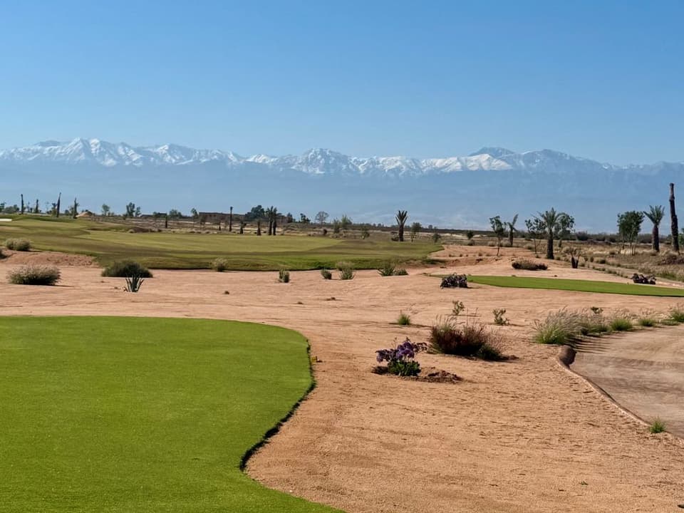 Desert waste areas at Akenza with the snowy Atlas beyond