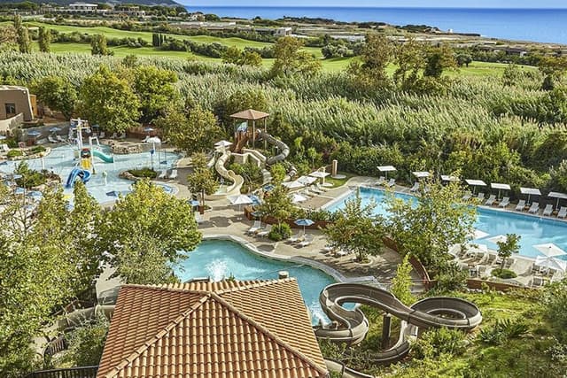 Aerial view of the Westin pools, the Dunes Course fairways and the sea at Navarino Dunes