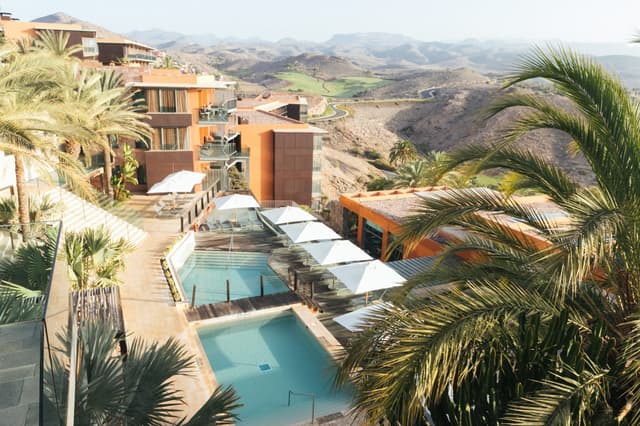 Salobre Hotel's pools from above, against the volcanic hills