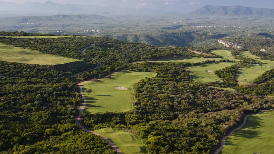 Aerial view of the Hills Course fairways, with the Messinian mountains behind